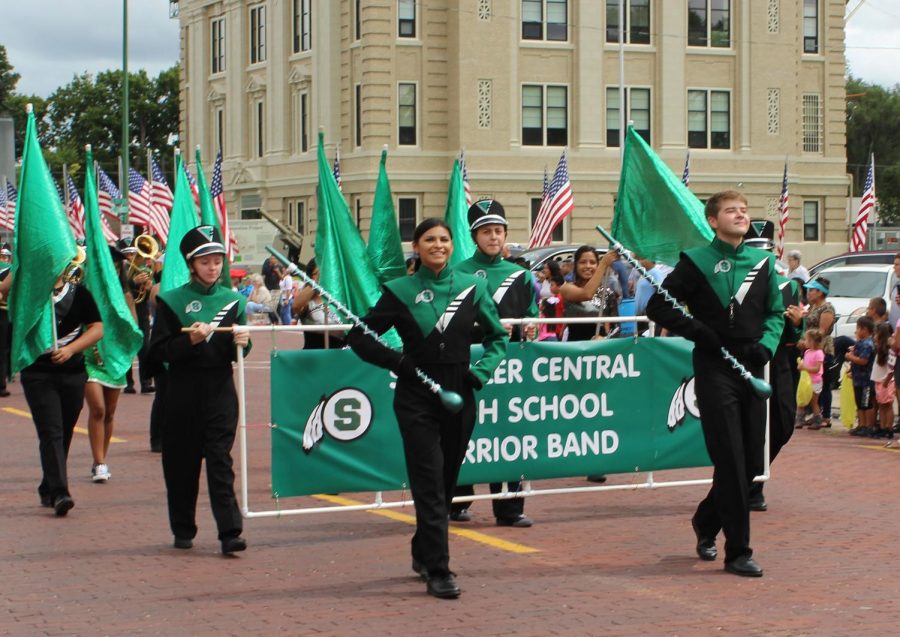 Drum Majors, Pammela Garcia and Kasey Brabec, lead the band in the Schuyler Labor Day Parade.