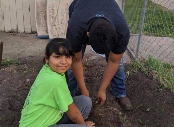 Bryan+and+Yareli+Romero+help+plant+trees+with+the+SCS+Warriors+Academy+program.