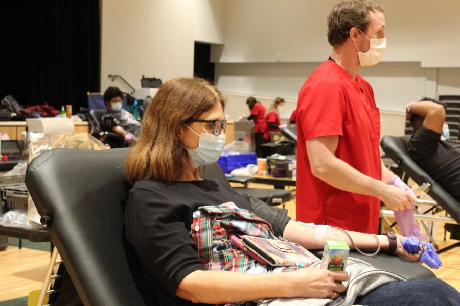 An individual from the community donating blood. 