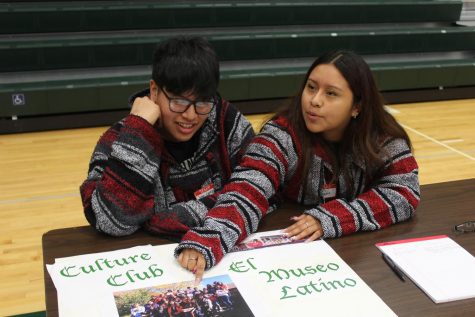 Culture Club Members representing Culture Club at their table in the west gym to recruit new members.