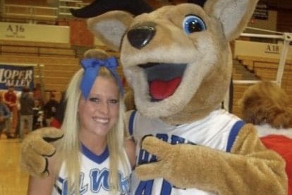 Molly Parsons poses with the UNK mascot.