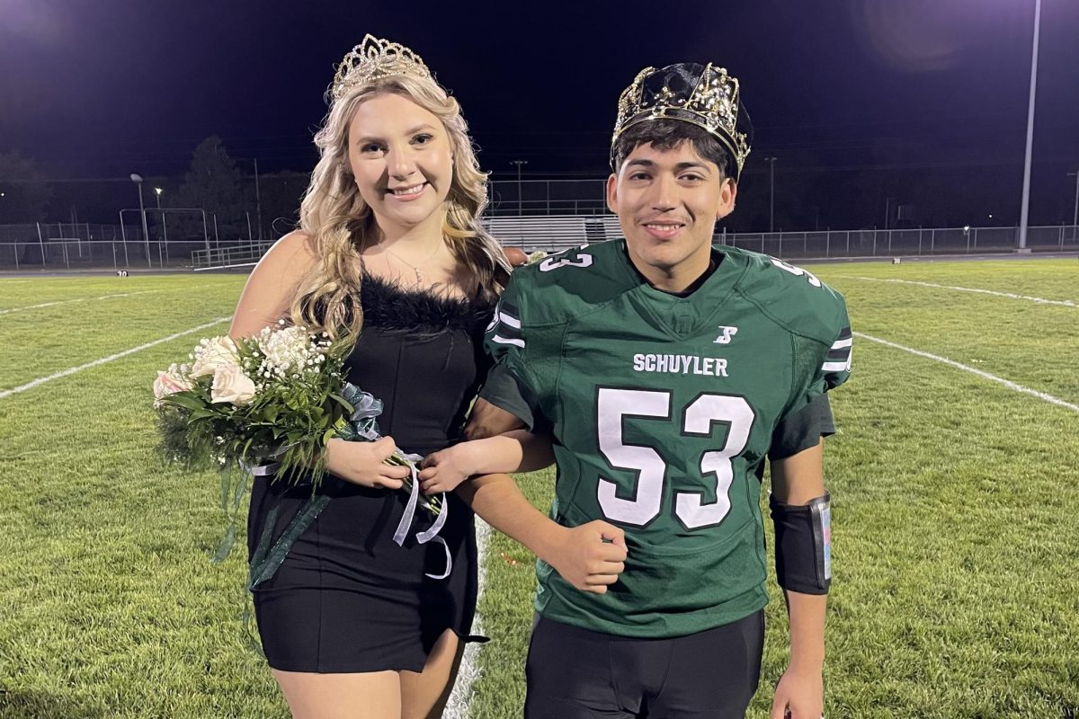 Homecoming Queen and Homecoming king at the football game.
