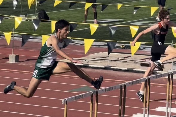 Carlos Carrasco competing in the 300 hurdles.